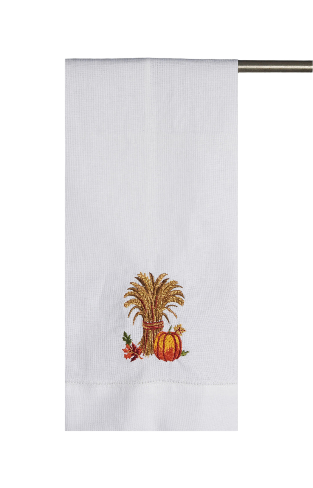 White towel with embroidered design of a corn stalk and pumpkin on a white background