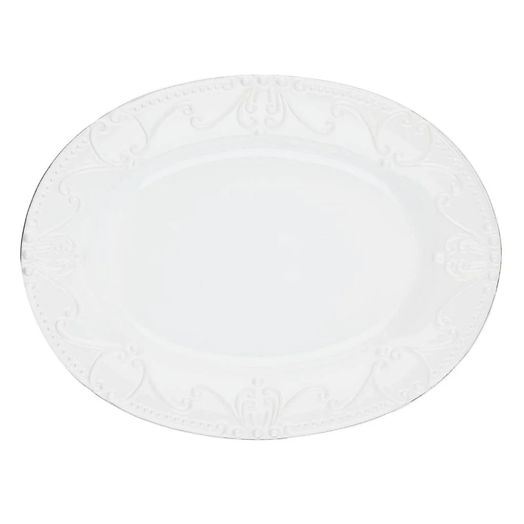 Round white plate with subtle pattern on a white background