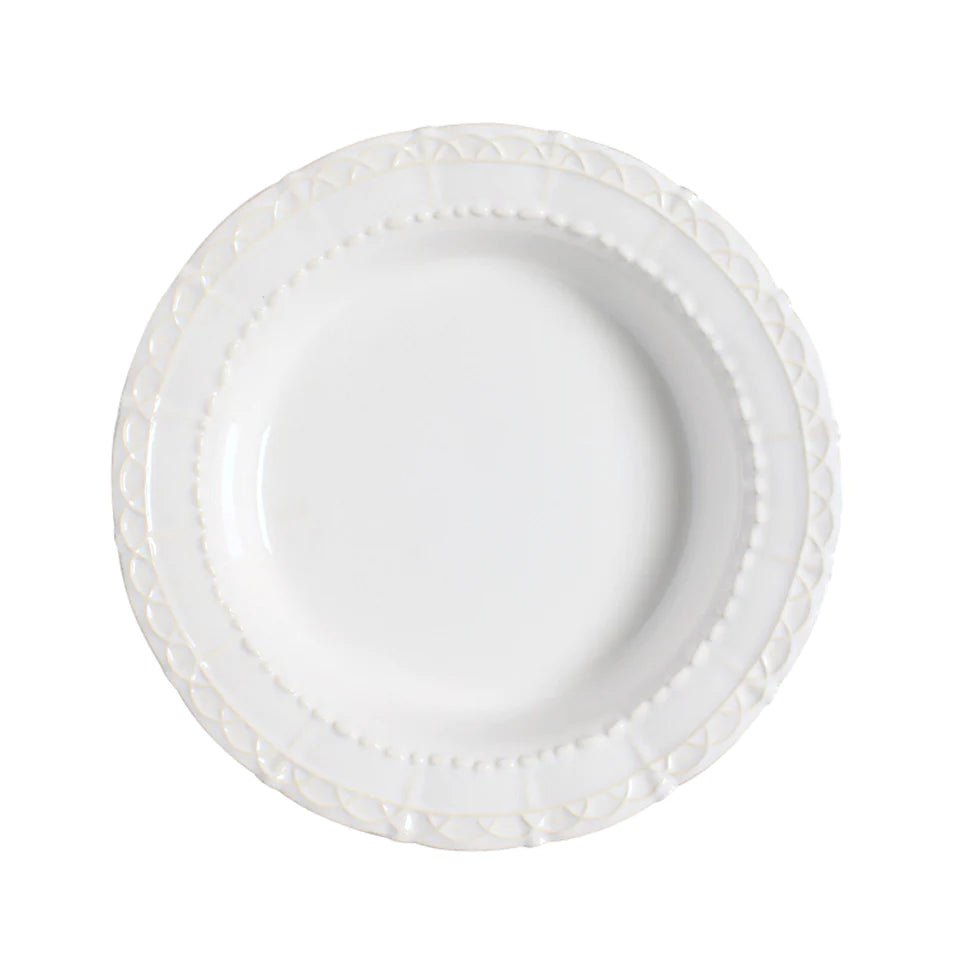 ornate ceramic pastal bowl in white on white background