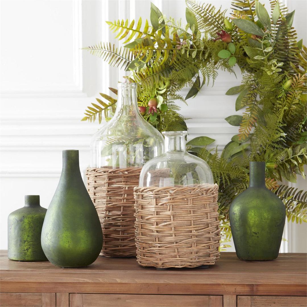 CLEAR GLASS BOTTLE IN RATTAN BASKET