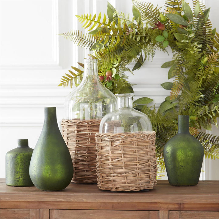 CLEAR GLASS BOTTLE IN RATTAN BASKET