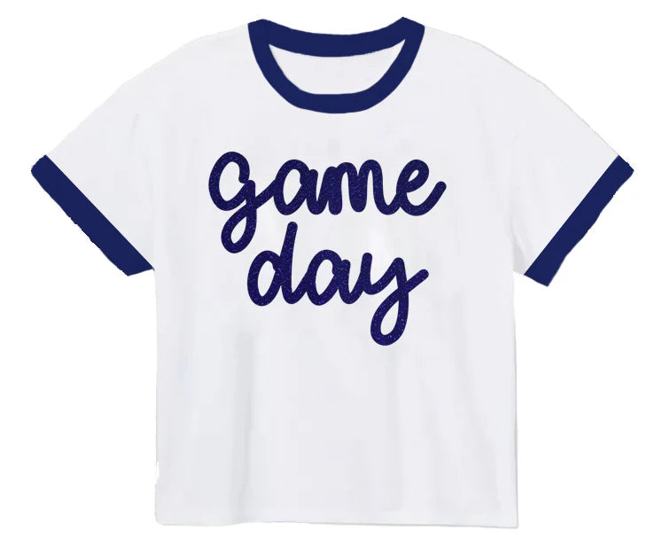 White t-shirt with blue ringer sleeves and 'game day' text on a white background