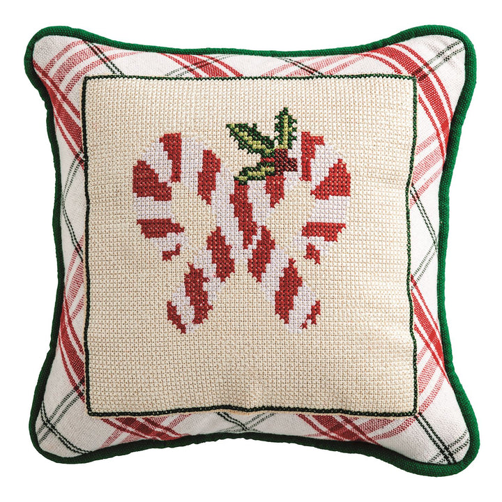 Woven cotton pillow features needlepoint panel and piped edge.