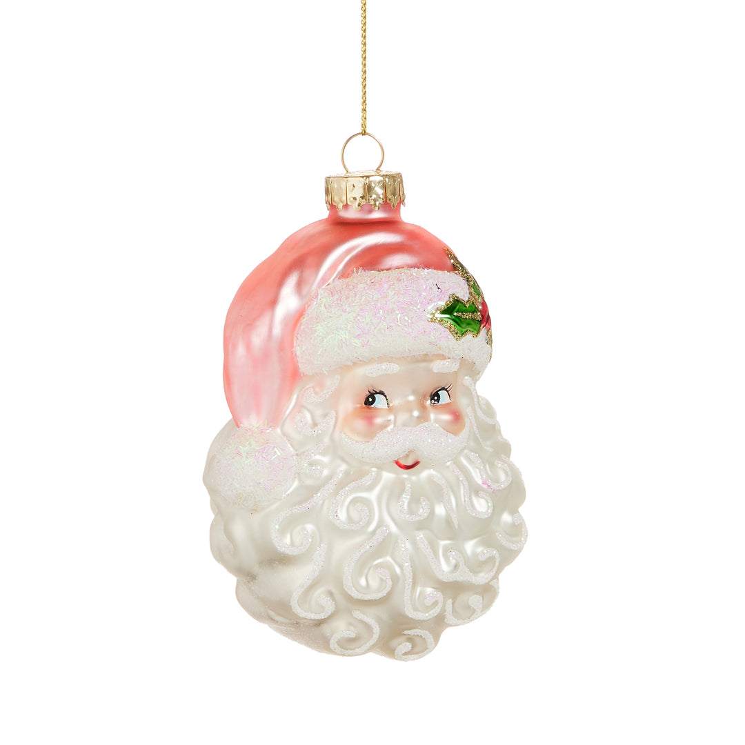 Glass ornament shaped like a face with a pink top on a white background