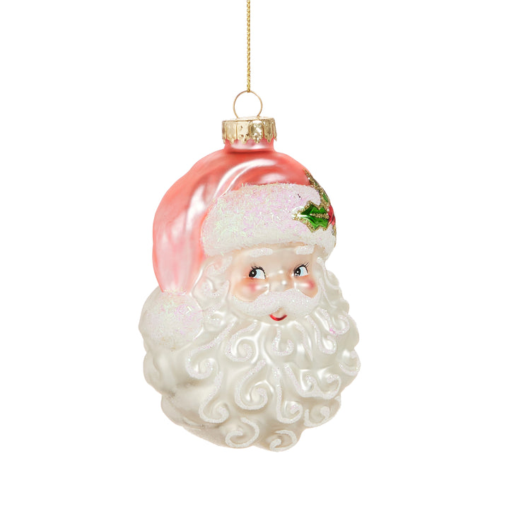 Glass ornament shaped like a face with a pink top on a white background