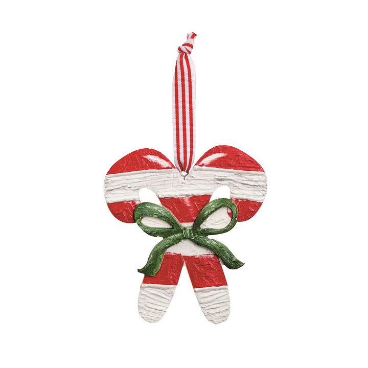 two candy canes with green bow ornament