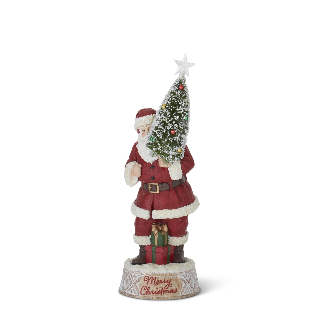 santa holding bottle brush tree