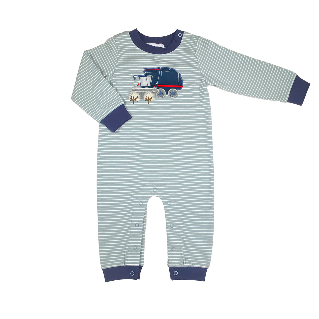 Striped baby romper with train design on a white background
