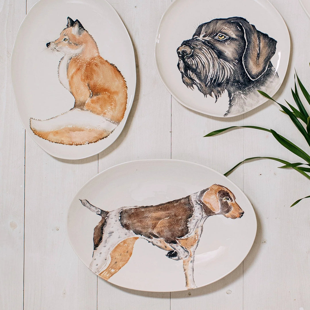 bowls and plates with various hand painted animals