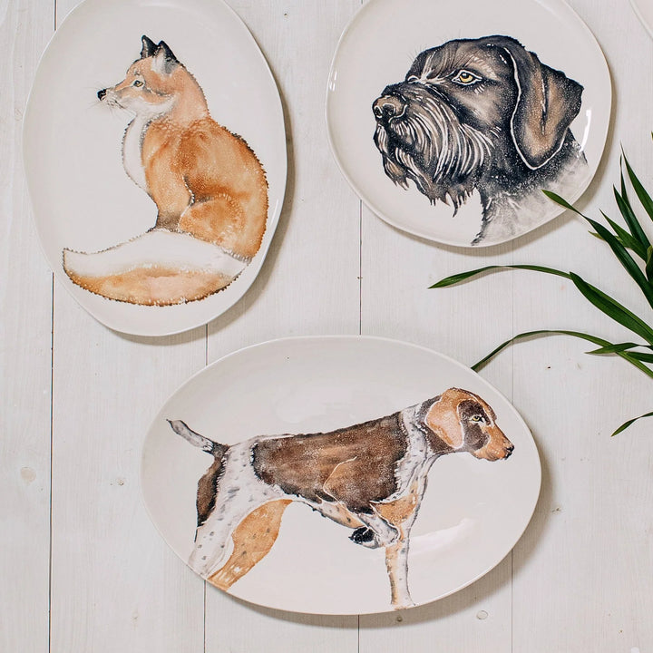 bowls and plates with various hand painted animals