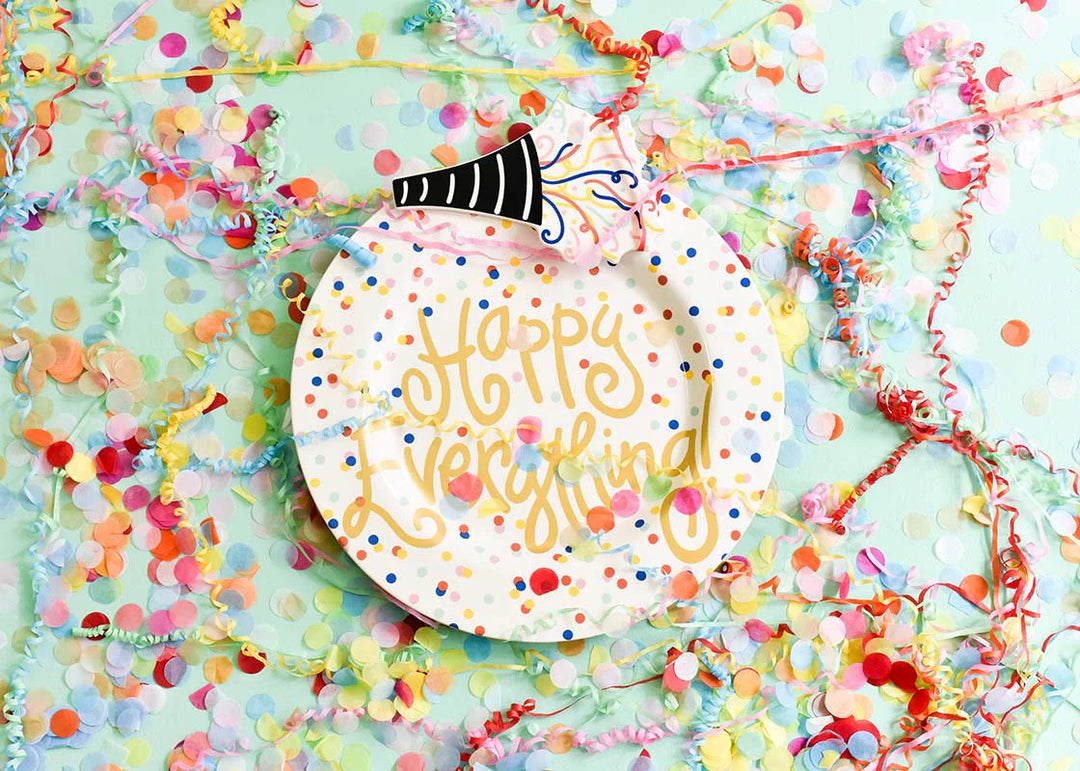 Decorative plate with 'Happy Everything' text on a colorful confetti background