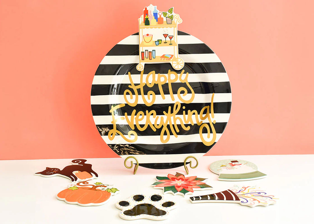 Decorative plate with 'Happy Everything!' text on a striped background