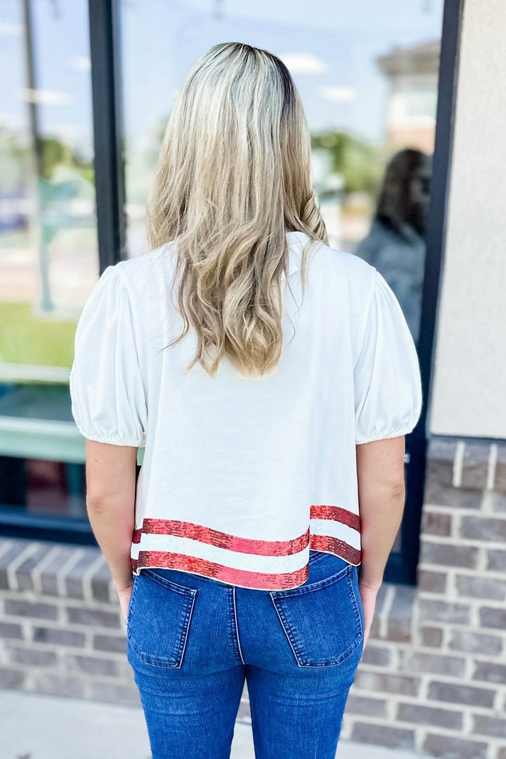 STARS & STRIPES SCRIPT SEQUIN HEM TOP