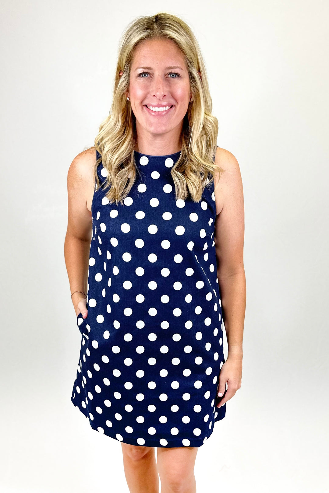 NAVY POLKA DOT SLEEVELESS DRESS