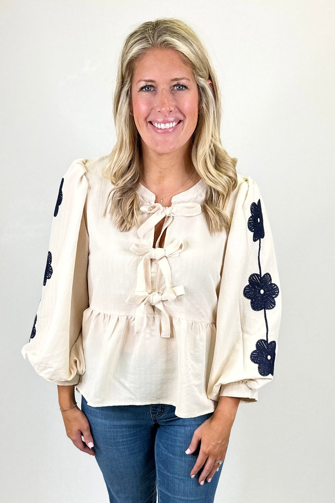 CREAM & NAVY FLORAL EMBROIDERED PEPLUM TOP