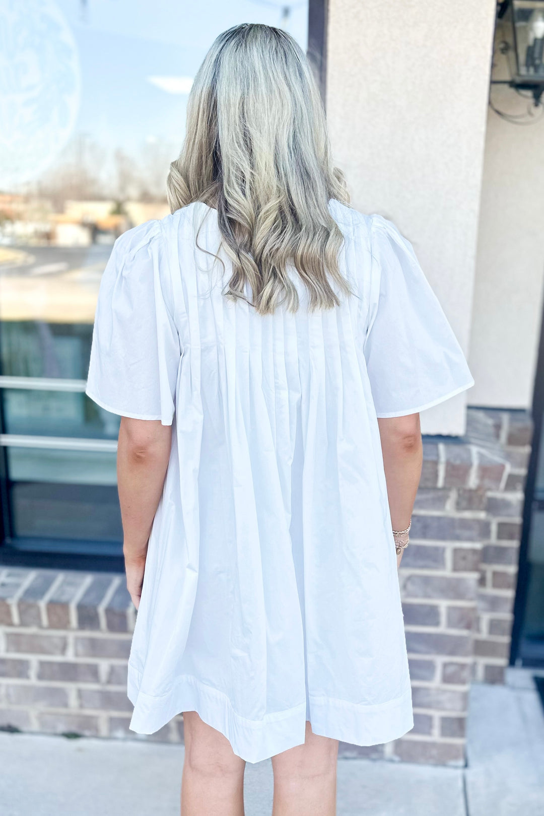 WHITE TUCK PLEAT TIE FRONT BABYDOLL DRESS