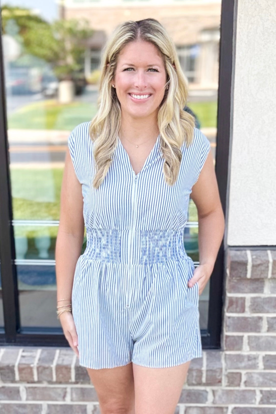 NAVY STRIPE SMOCKED WAIST ZIP FRONT ROMPER
