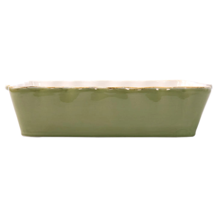 A green rectangular Italian baker with scalloped edges.