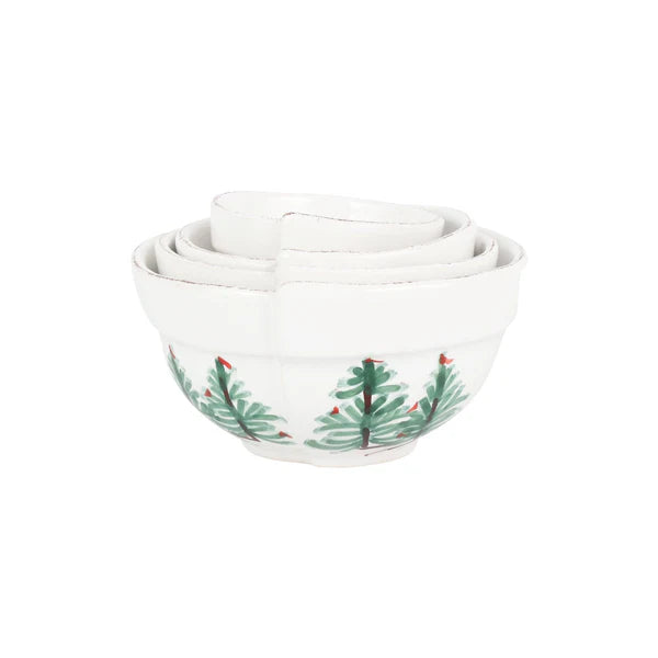 Set of three white bowls with Christmas tree design on a white background