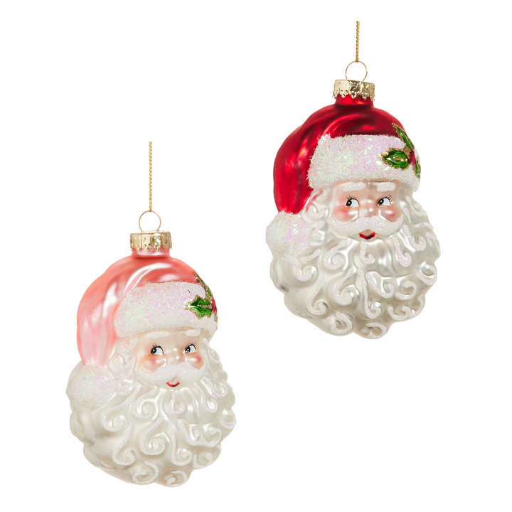 Two glass Santa Claus ornaments on a white background