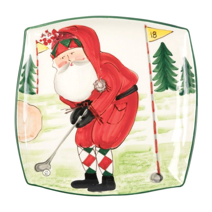 Handpainted square ceramic platter with a Christmas themed design of Santa Claus golfing, surrounded by greenery and holiday decorations.