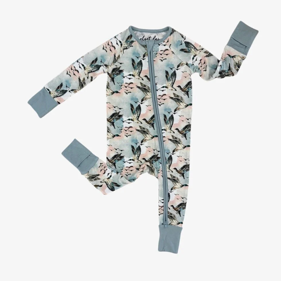 Baby onesie with floral pattern and gray accents on a white background