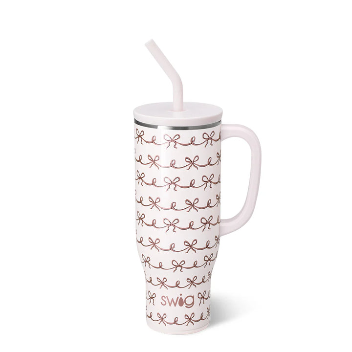 Tumbler with decorative pattern and straw on a white background