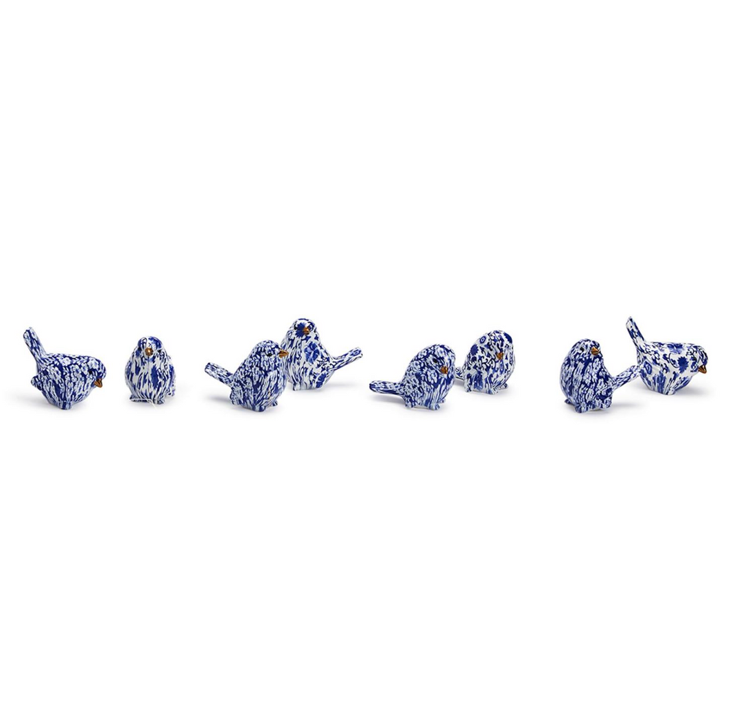 A set of resin robin figurines in a blue and white chinoiserie pattern.