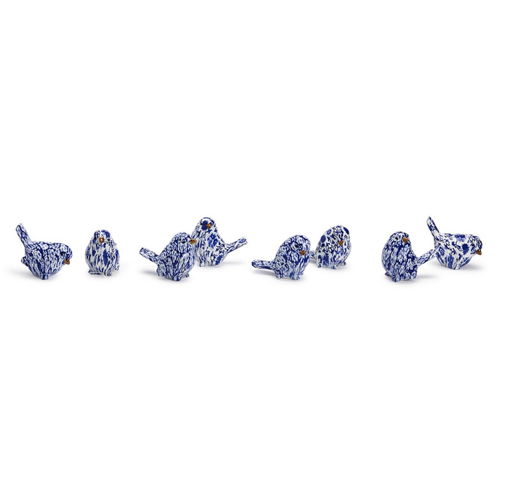 A set of resin robin figurines in a blue and white chinoiserie pattern.