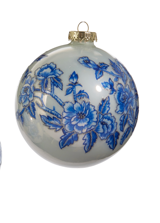 Decorative glass ball with blue floral patterns on a white background