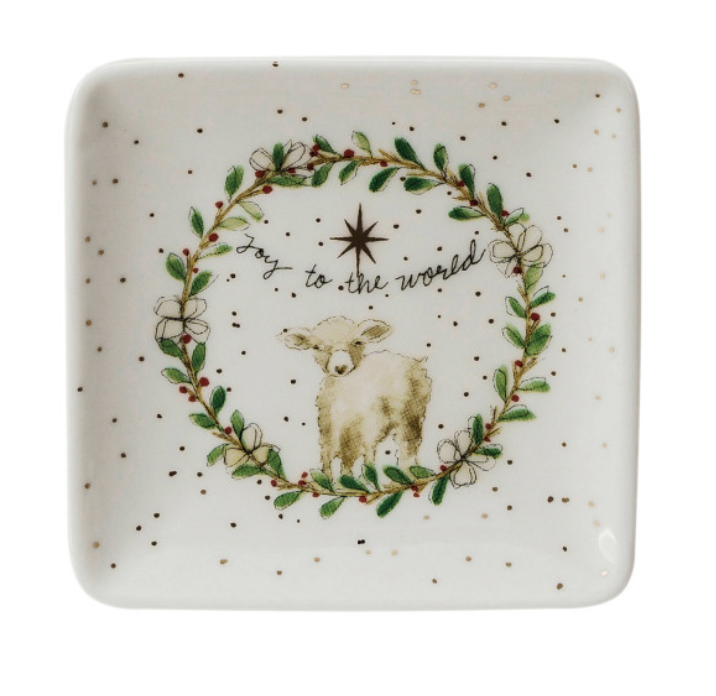 Decorative plate with a lamb and wreath design on a white background