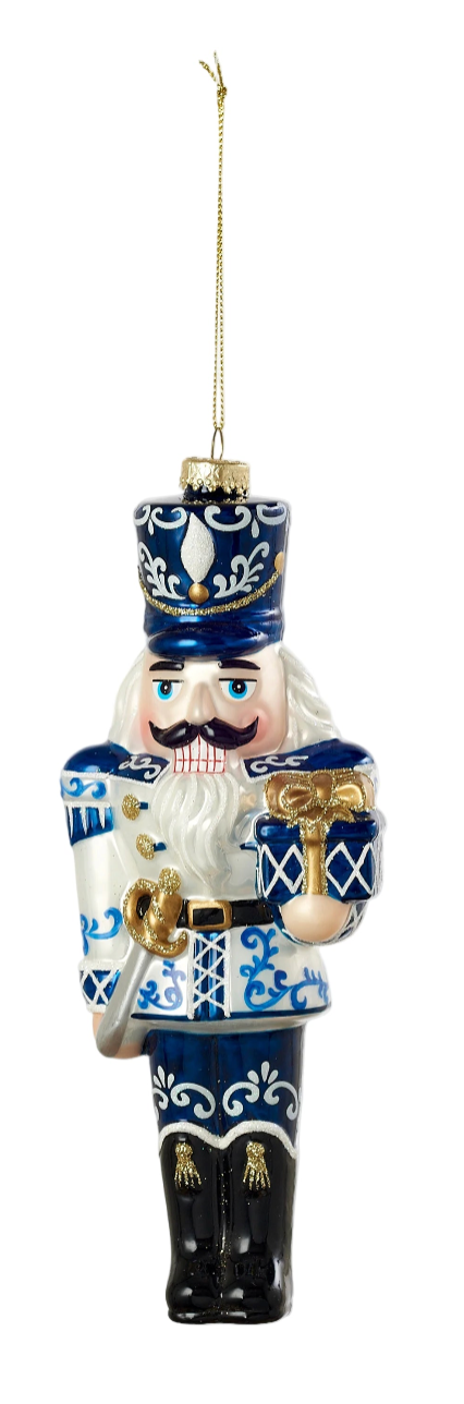 Decorative nutcracker ornament with blue and white pattern on a white background