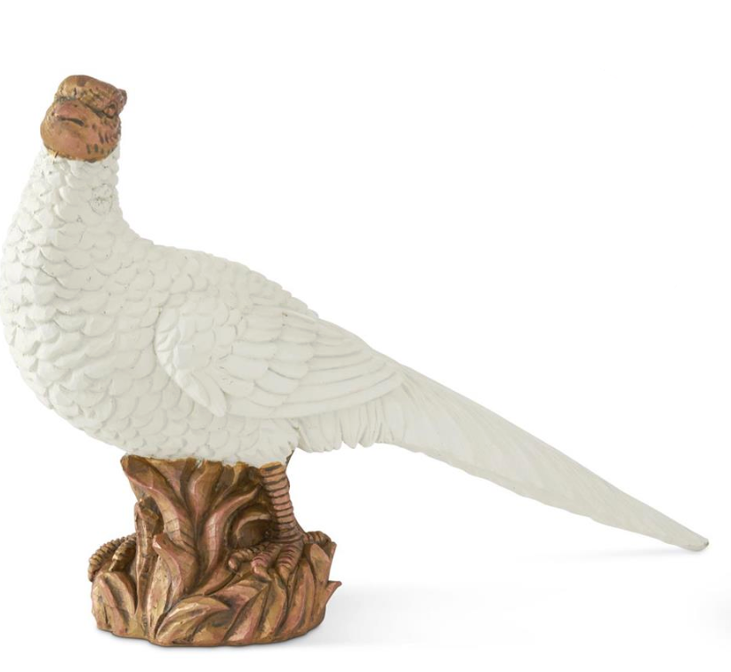 White bird figurine on a brown base with a white feather on a white background