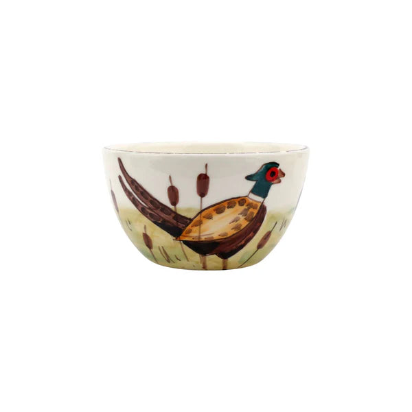 Ceramic bowl with a painted design of a bird on a white background
