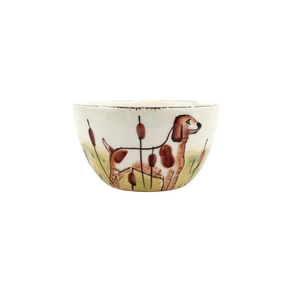 Ceramic bowl with a dog and reed design on a white background