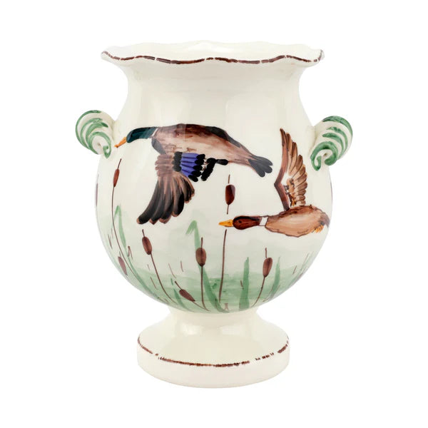 Ceramic vase with bird designs on a white background
