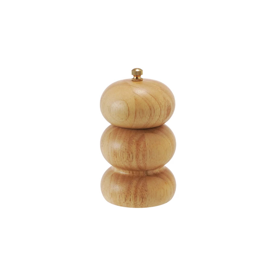 Wooden salt or pepper shaker on a white background