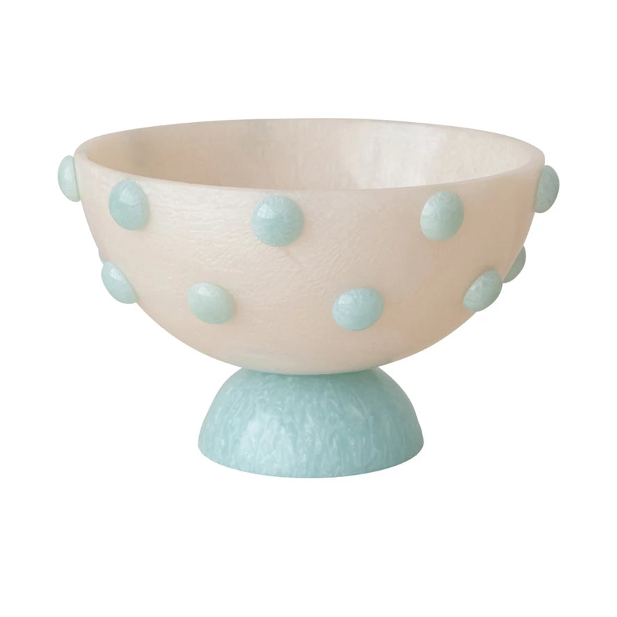 Decorative bowl with light pink top and light blue base, featuring light blue polka dots.