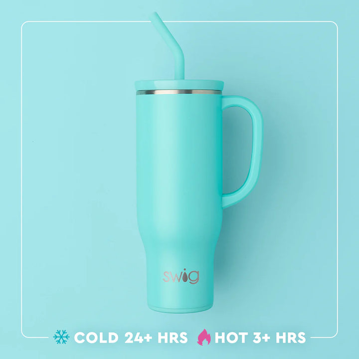 Turquoise mug with handle and straw on a light blue background, featuring the Swig brand.