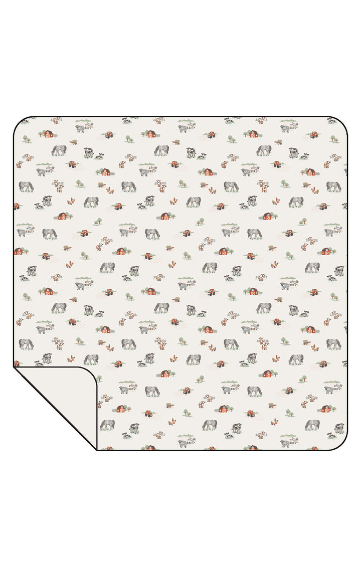 Patterned blanket with small illustrations on a white background
