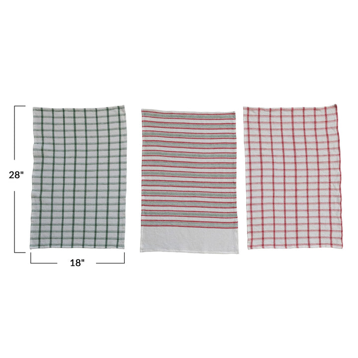 Three fabric towels with different patterns and measurements on a white background
