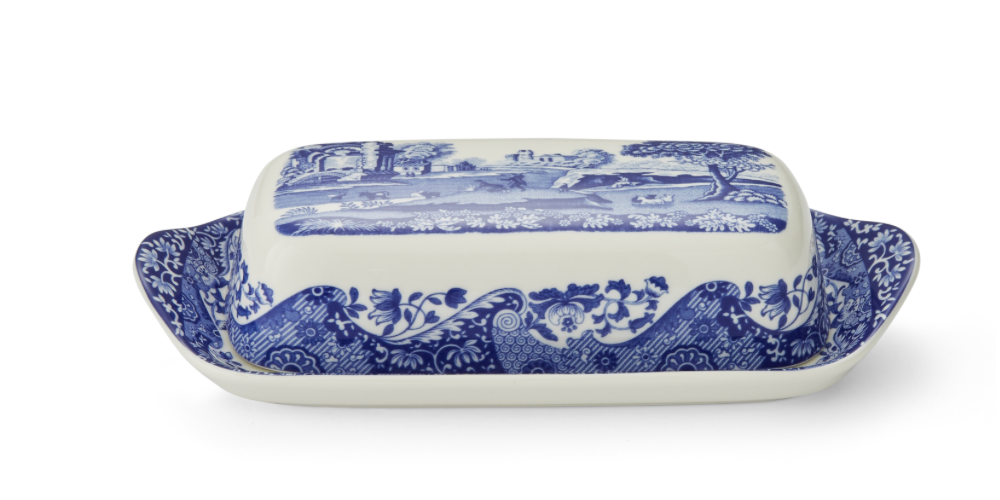 A blue and white porcelain butter dish with floral patterns, lid included.