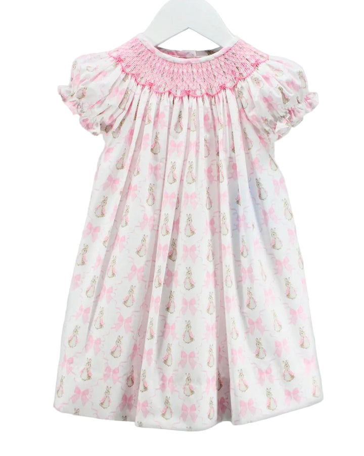 Children's dress with pink floral pattern on a white background