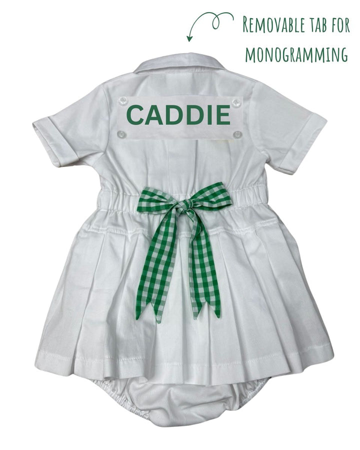 White baby romper with 'CADDIE' text and green checkered bow on a white background