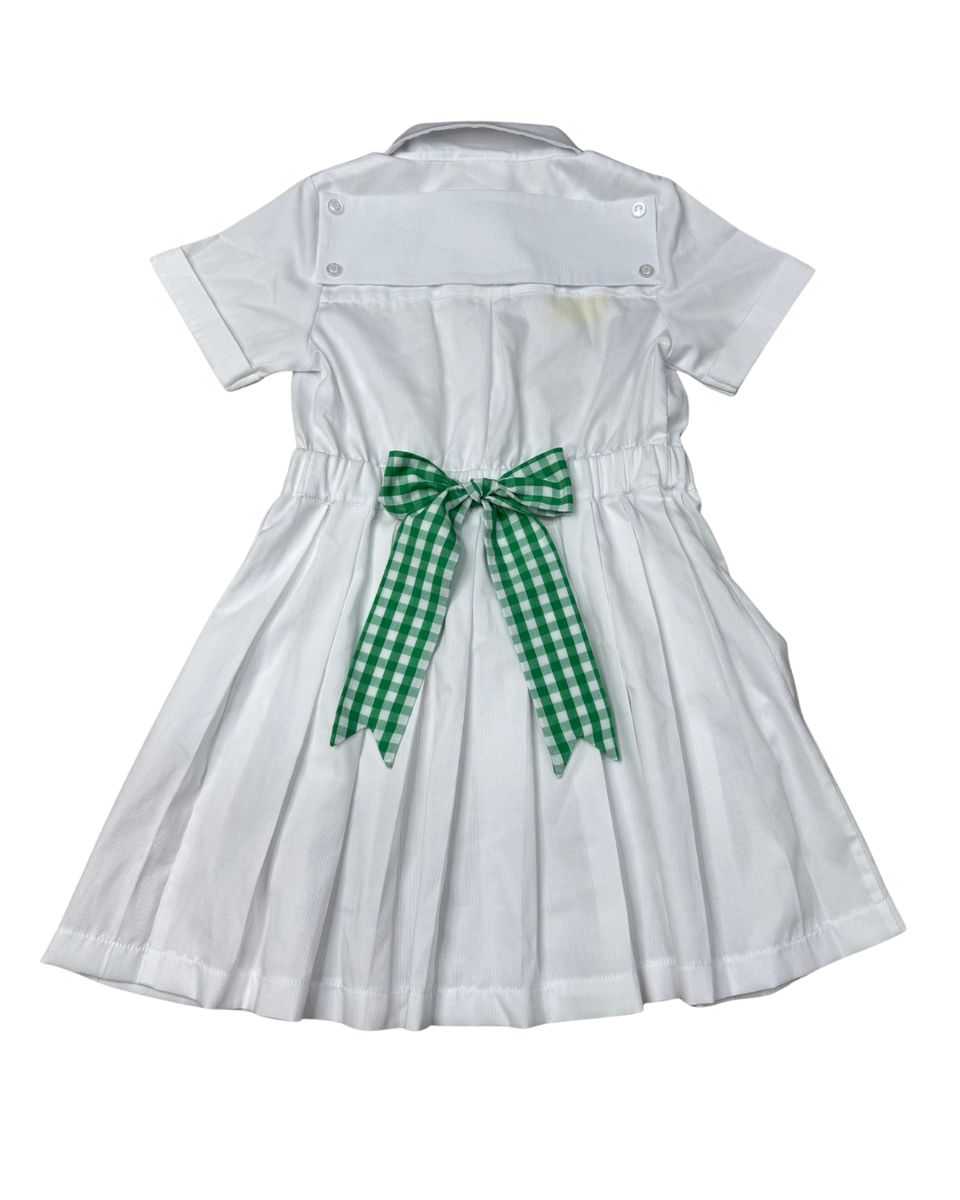 White dress with a green checkered bow on a white background