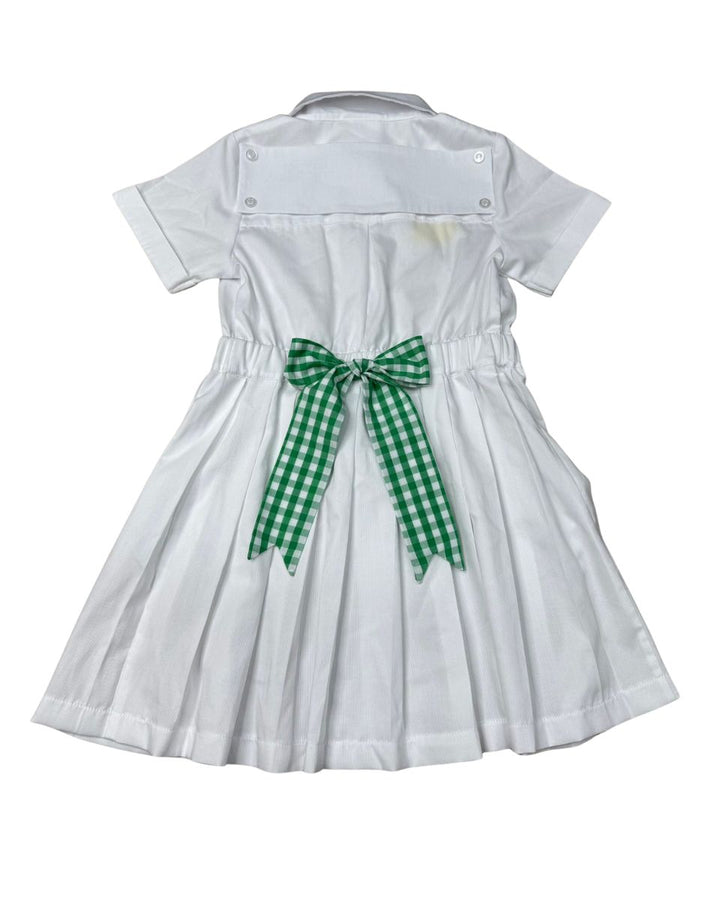 White dress with a green checkered bow on a white background