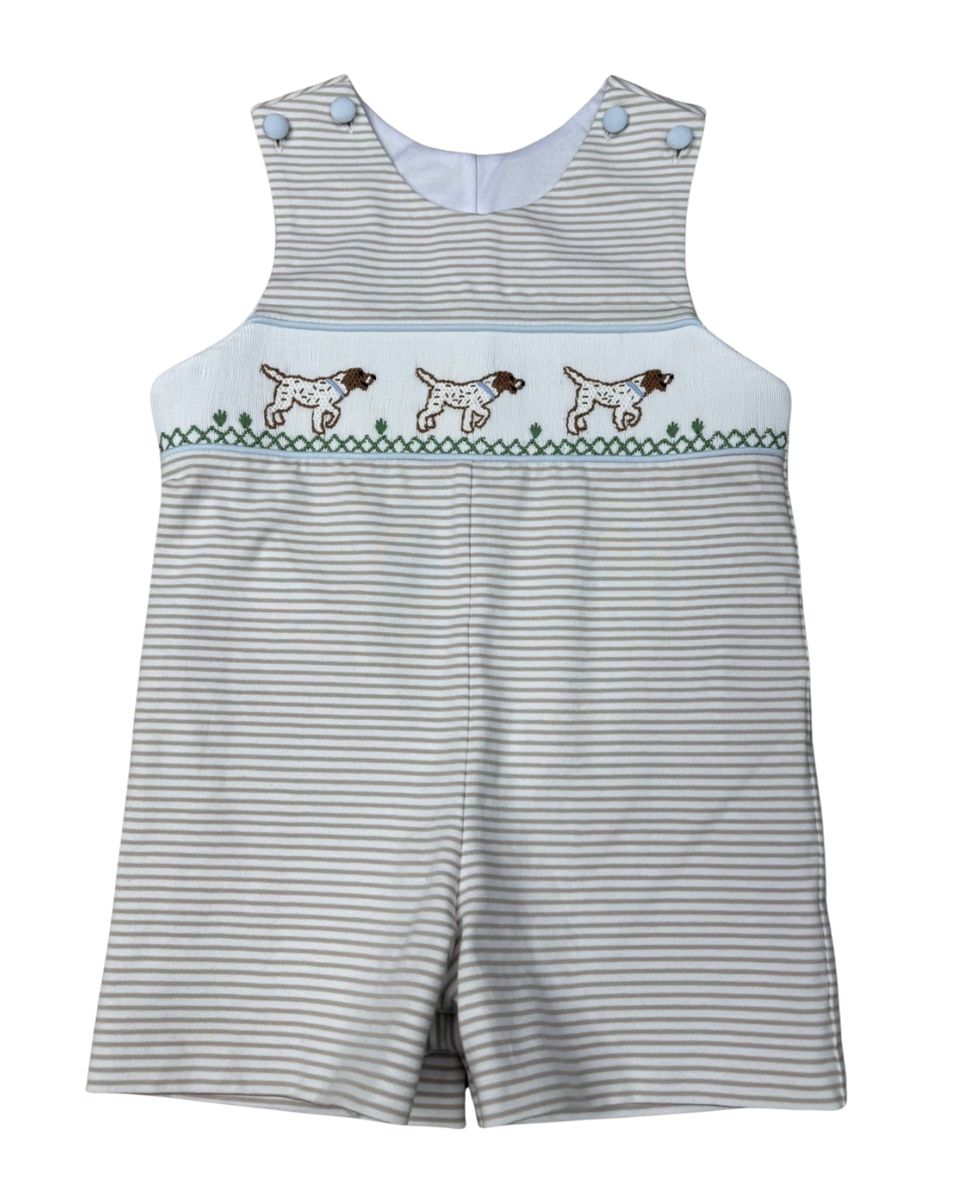 Striped overalls with embroidered dogs on a white background