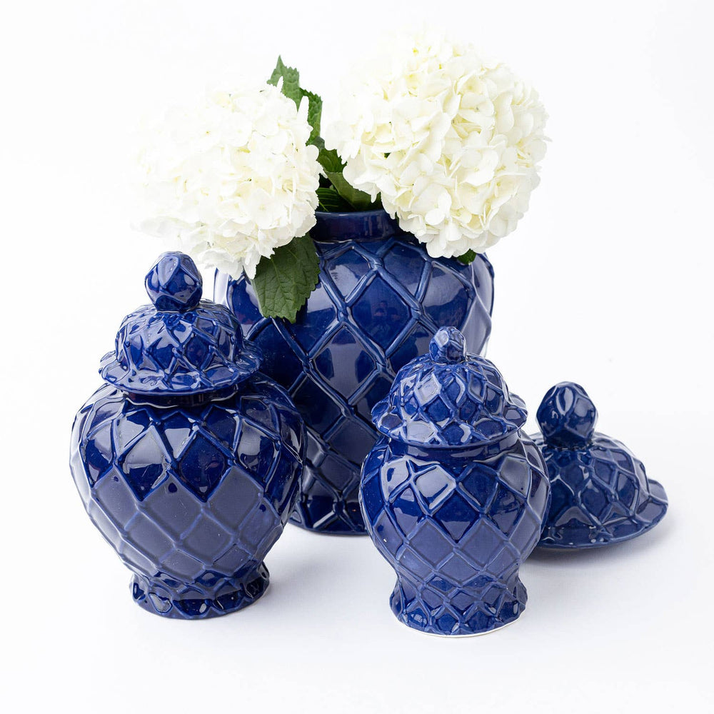 navy ginger jars in 3 sizes with flowers in biggest