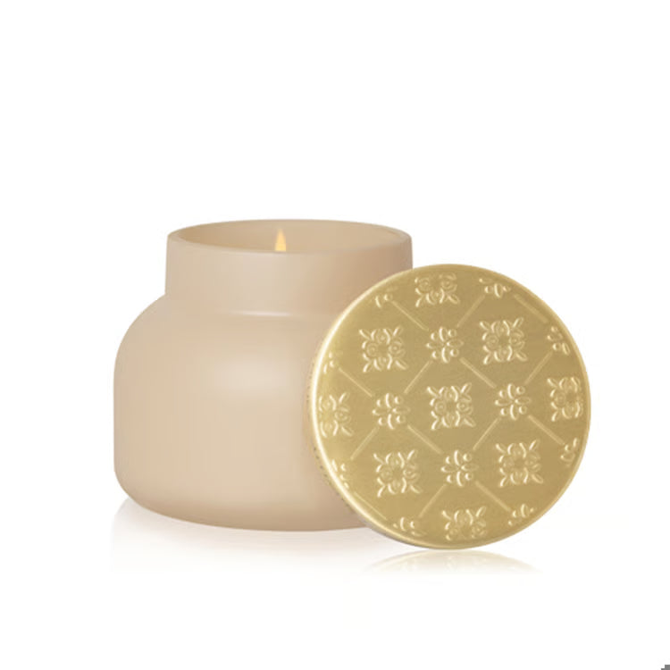 beige large candle in coconut santal scent