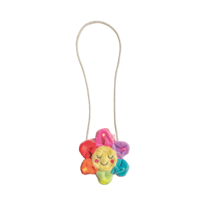 Colorful plush flower purse with a string on a white background